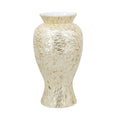 Gold and white Capiz shell motif vase on a white background